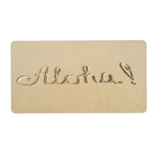 Aloha word sign on the beach sand