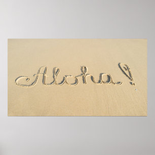 Aloha word sign on the beach sand