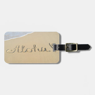 Aloha word sign on the beach sand luggage tag