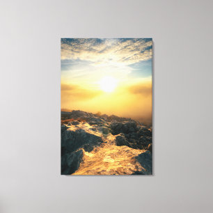 Amazing sunset above clouds and sun lit rocks canvas print
