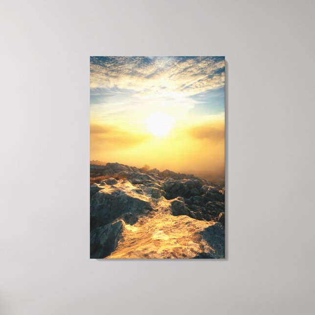 Amazing sunset above clouds and sun lit rocks canvas print (Front)