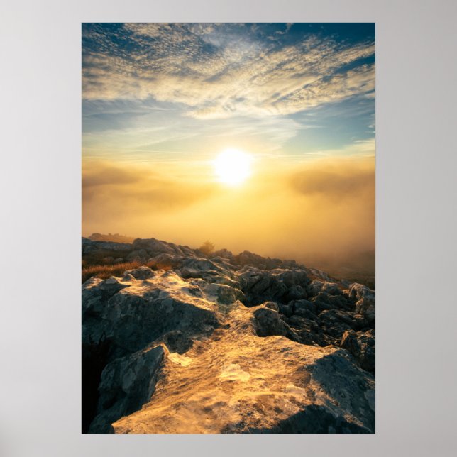 Amazing sunset above clouds and sun lit rocks poster (Front)