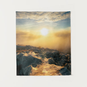 Amazing sunset above clouds and sun lit rocks tapestry