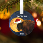 American Bison, Full Moon and Santa Hat    Ornament<br><div class="desc">An American buffalo wearing a Santa hat stands under a starry night sky and a bright full moon.</div>