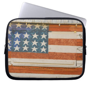 American flag painted onto fireworks stand near laptop sleeve