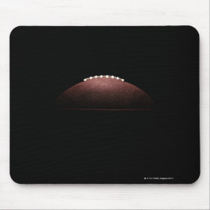 American football ball on black background mouse pad