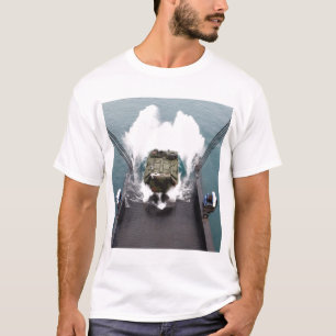 Amphibious assault vehicles disembark from USNS T-Shirt