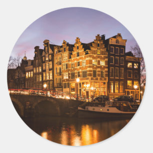 Amsterdam canal houses at dusk round sticker
