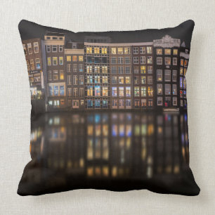 Amsterdam houses with colourful lights in the cushion