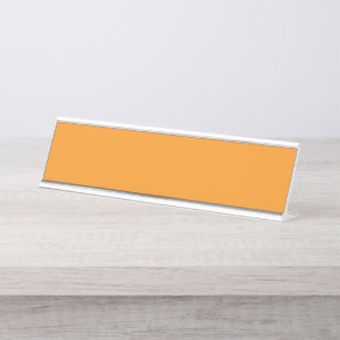 An abstract blend of vibrant orange, red, and yell desk name plate