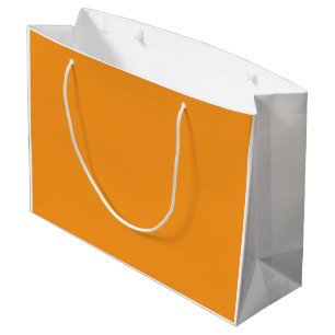 An abstract blend of vibrant orange, red, and yell large gift bag