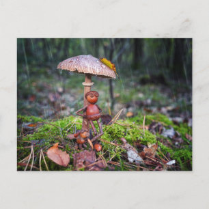 An acorn elf is hiding under a mushroom with a dog postcard