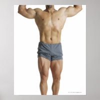 an adult caucasian male bodybuilder holds his