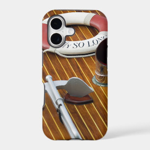 An Anchor And A Life-Buoy On A Wooden Boat