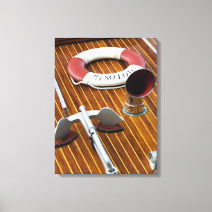 An Anchor And A Life-Buoy On A Wooden Boat Canvas Print