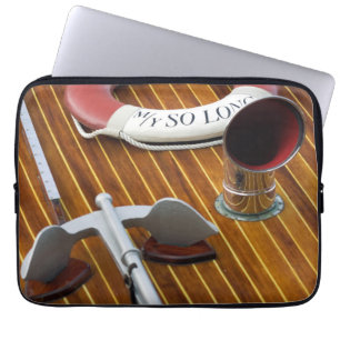 An Anchor And A Life-Buoy On A Wooden Boat Laptop Sleeve