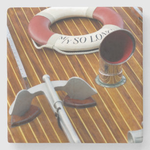 An Anchor And A Life-Buoy On A Wooden Boat Stone Coaster