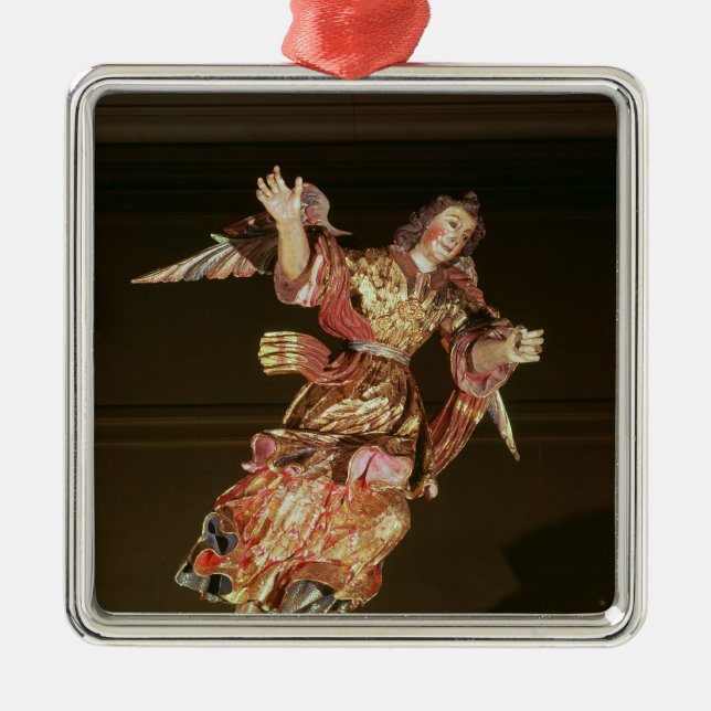 An angel above the altarpiece metal tree decoration (Front)