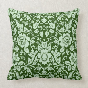 An antique floral damask cushion