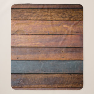 An antique wood wall texture background with metal sherpa blanket