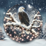 An Eagle atop a Snow filled Branch Christmas Classic Round Sticker<br><div class="desc">An eagle sitting on a snowy branch  in a tree full of pretty twinkling white Christmas lights.</div>