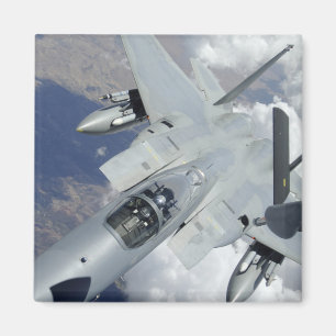 An F-15 Eagle pulls away from a KC-135 Magnet