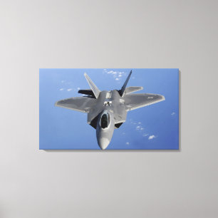 An F-22 Raptor moves into position to receive f 2 Canvas Print