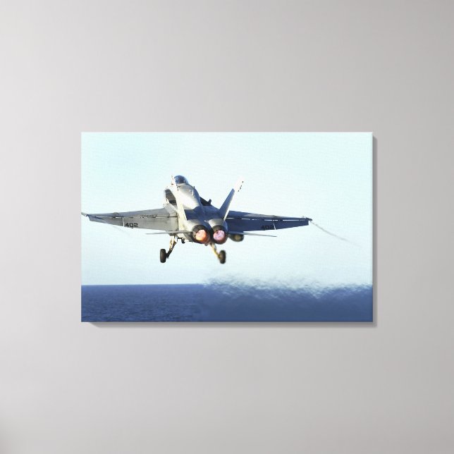 An F/A-18C Hornet launches from the flight deck 2 Canvas Print (Front)