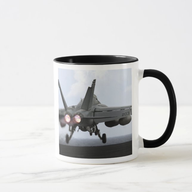 An F/A-18E Super Hornet launches Mug (Right)