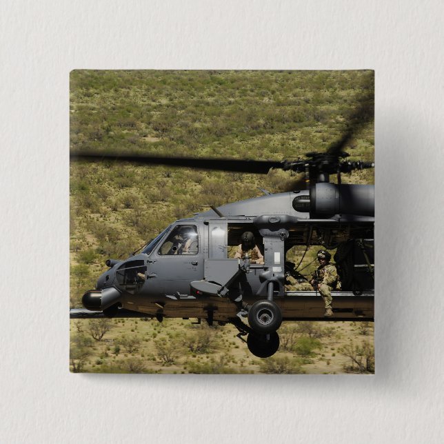 An HH-60 Pave Hawk flies over the desert 15 Cm Square Badge (Front)