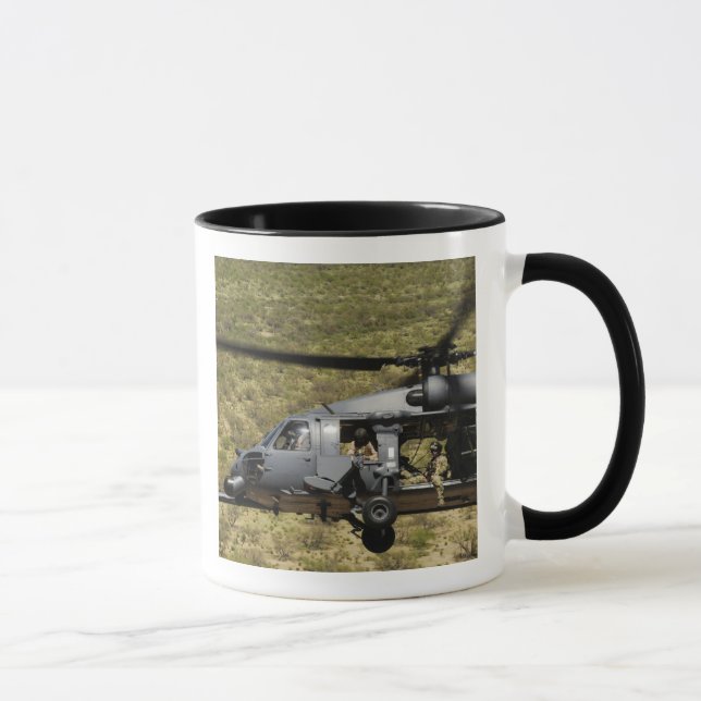 An HH-60 Pave Hawk flies over the desert Mug (Right)