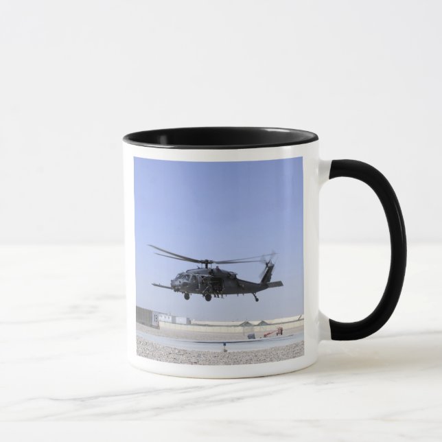 An HH-60G Pave Hawk taking off from Camp Bastio Mug (Right)