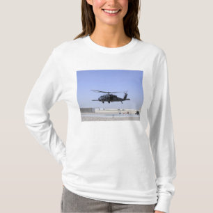 An HH-60G Pave Hawk taking off from Camp Bastio T-Shirt