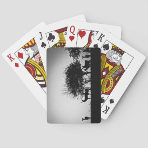 An image of some deer in the morning mist playing cards