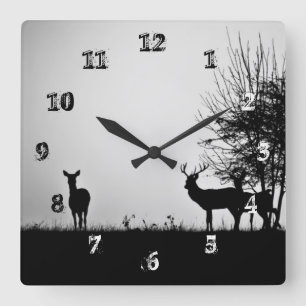 An image of some deer in the morning mist square wall clock