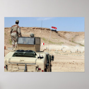 An instructor watches as an Iraqi army soldier Poster