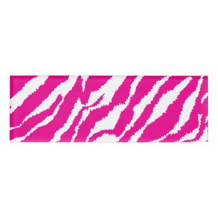 An intricate floral pattern in pink and white, art name tag