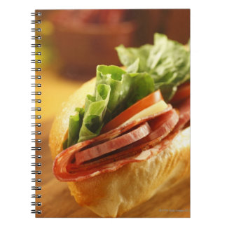 An Italian sub sandwich with Spiral Notebook