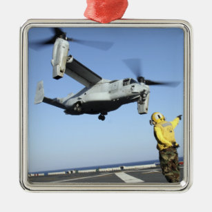An MV-22 Osprey launches from the USS Nassau Metal Tree Decoration