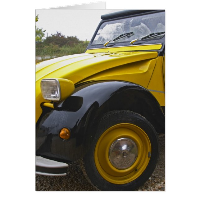 An old black and yellow Citroen 2CV 2 CV, (Front)