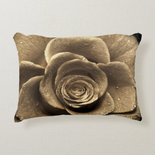 An old-fashioned rose close up, wet with water dro decorative cushion