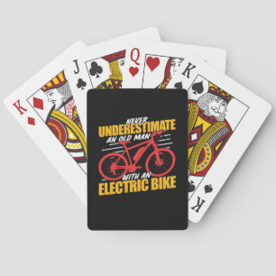 An Old Man With An Electrec Bike Playing Cards