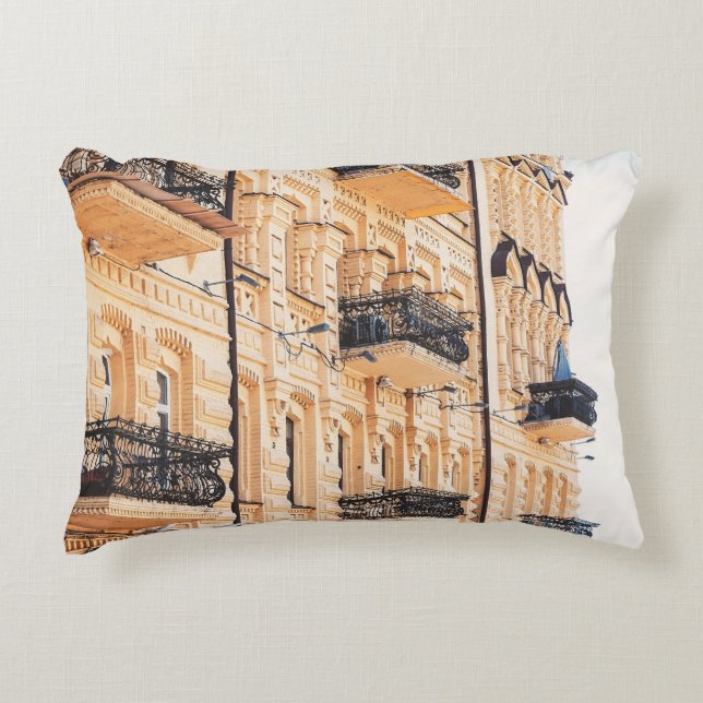 An old yellow house with wrought-iron balconies. f decorative cushion (Front)