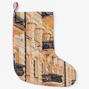 An old yellow house with wrought-iron balconies. f small christmas stocking