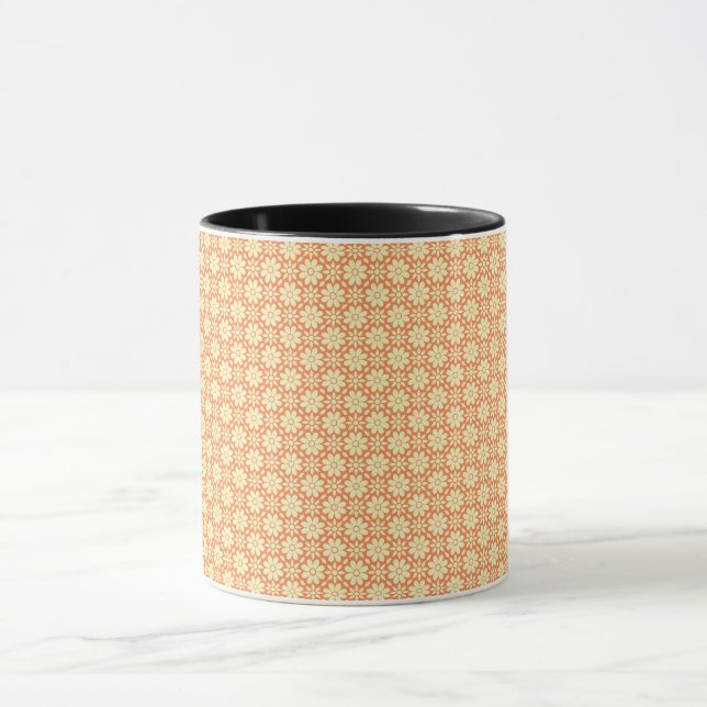 an orange and white background with a pattern mug (Center)