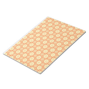 an orange and white background with a pattern notepad