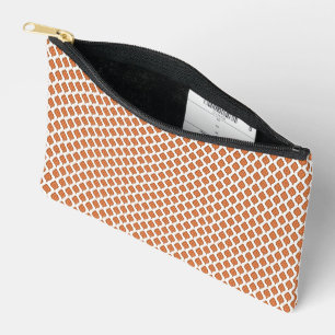 an orange and white geometric pattern accessory pouch
