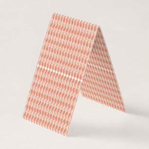 an orange and white pattern on a white background business card