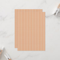 an orange and white striped background with small