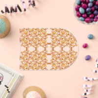 an orange and white wallpaper with a floral design